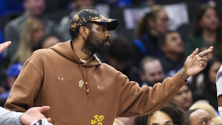 Jan 7, 2025; Dallas, Texas, USA;  Dallas Mavericks guard Kyrie Irving reacts on the bench during the first half against the Los Angeles Lakers at American Airlines Center. Mandatory Credit: Kevin Jairaj-Imagn Images