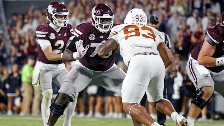 Oct 25, 2025; Starkville, Mississippi, USA; Mississippi State Bulldogs offensive linemen Jacoby Jackson (75) blocks Texas Longhorns defensive linemen Hero Kanu (93) during overtime at Davis Wade Stadium at Scott Field. Mandatory Credit: Petre Thomas-Imagn Images