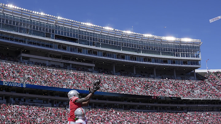 April 13, 2024; Columbus, Ohio, USA; 
Ohio State Buckeyes wide receiver Jeremiah Smith (4) playing for the scarlet team can't reel in a pass while defended by cornerback Davison Igbinosun (1) of the gray team of the during the first half of the LifeSports Spring Game at Ohio Stadium on Saturday.