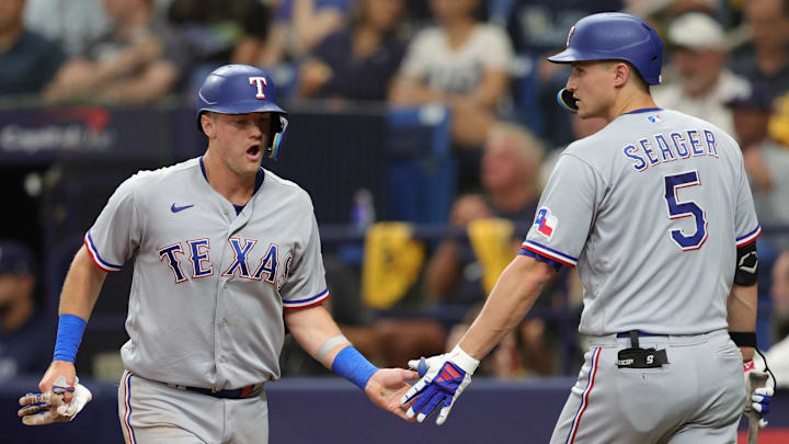 Texas Rangers third baseman Josh Jung (6) high fives.