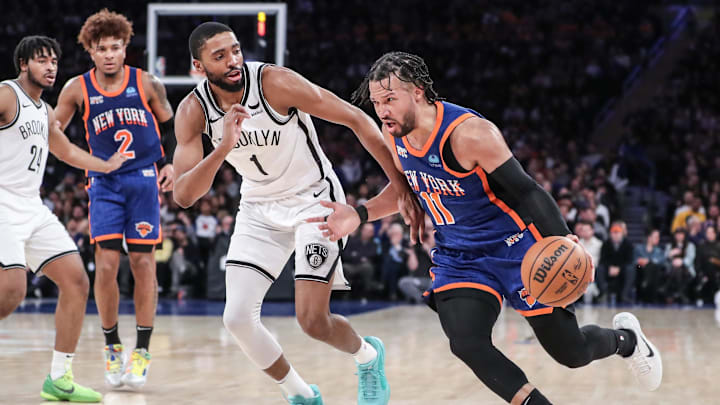 Mar 23, 2024; New York, New York, USA;  New York Knicks guard Jalen Brunson (11) drives past Brooklyn Nets forward Mikal Bridges (1) in the third quarter at Madison Square Garden. Mandatory Credit: Wendell Cruz-Imagn Images