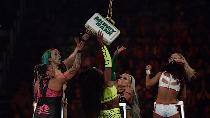 Jul 18, 2021; Fort Worth, TX, USA; Nikki A.S.H. (gold/blue) and Naomi (neon) and Natalya (reb/black)