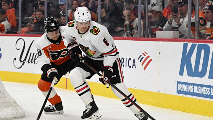 Mar 26, 2026; Philadelphia, Pennsylvania, USA; Chicago Blackhawks center Ryan Donato (8) is defended by Philadelphia Flyers defenseman Emil Andrae (36) during the second period at Xfinity Mobile Arena. Mandatory Credit: Eric Hartline-Imagn Images