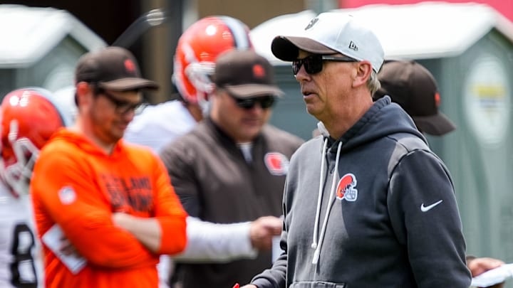 Cleveland Browns coach Todd Monken, left, walks the field between plays during the first day of rookie minicamp May 8, 2026, at Cross Country Mortgage Campus in Berea, Ohio.