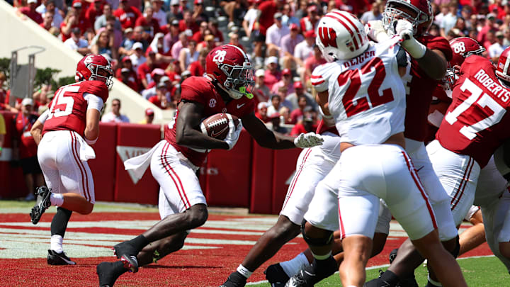 Sep 13, 2025; Tuscaloosa, Alabama, USA; Alabama Crimson Tide running back Kevin Riley (28) looks for an opening in the line of scrimmage during the second quarter against the Wisconsin Badgers at Saban Field at Bryant-Denny Stadium.