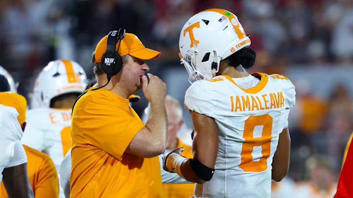 Tennessee Volunteers head coach Josh Heupel (left) speaks with former Tennessee Volunteers quarterback Nico Iamaleava.