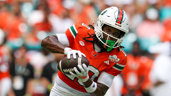 Sep 13, 2025; Miami Gardens, Florida, USA; Miami Hurricanes wide receiver Malachi Toney (10) warms up before a game against the South Florida Bulls at Hard Rock Stadium. Mandatory Credit: Nathan Ray Seebeck-Imagn Images
