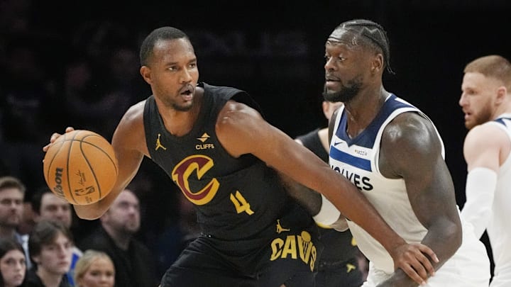 Jan 8, 2026; Minneapolis, Minnesota, USA; Cleveland Cavaliers forward Evan Mobley (4) works around Minnesota Timberwolves forward Julius Randle (30) in the third quarter at Target Center. Mandatory Credit: Bruce Kluckhohn-Imagn Images