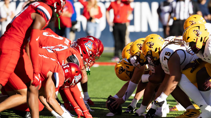 Nov 30, 2024; Tucson, Arizona, USA; General view down the line of scrimmage as the Arizona State Sun Devils prepare to snap the ball against the Arizona Wildcats in the first half during the Territorial Cup at Arizona Stadium. Mandatory Credit: Mark J. Rebilas-Imagn Images Nov 30, 2024; Tucson, Arizona, USA; General view down the line of scrimmage as the Arizona State Sun Devils prepare to snap the ball against the Arizona Wildcats in the first half during the Territorial Cup at Arizona Stadium. Mandatory Credit: Mark J. Rebilas-Imagn Images