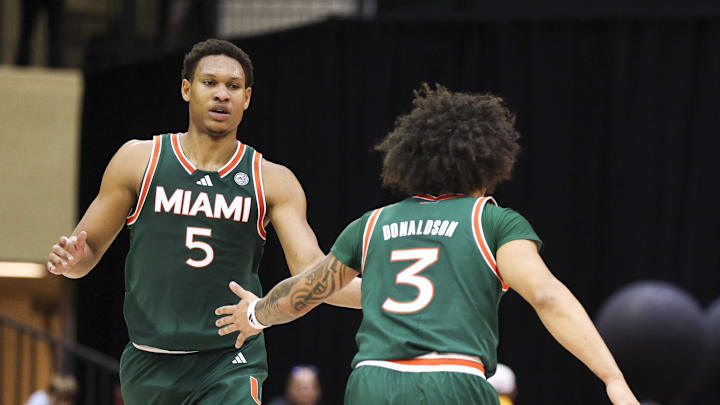 Nov 28, 2025; Kissimmee, FL, USA; Miami (FL) Hurricanes forward Malik Reneau (5) and guard Tre Donaldson (3) react after a basket against the Georgetown Hoyas in the first half during the ESPN Events Invitational at State Farm Field House. Mandatory Credit: Nathan Ray Seebeck-Imagn Images Nov 28, 2025; Kissimmee, FL, USA; Miami (FL) Hurricanes forward Malik Reneau (5) and guard Tre Donaldson (3) react after a basket against the Georgetown Hoyas in the first half during the ESPN Events Invitational at State Farm Field House. Mandatory Credit: Nathan Ray Seebeck-Imagn Images