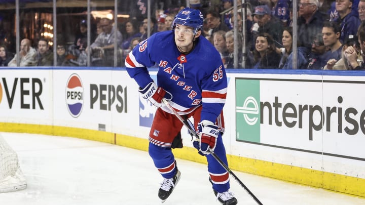 Apr 21, 2024; New York, New York, USA; New York Rangers defenseman Ryan Lindgren (55) controls the puck in the third period against the Washington Capitals in game one of the first round of the 2024 Stanley Cup Playoffs at Madison Square Garden. Mandatory Credit: Wendell Cruz-USA TODAY Sports