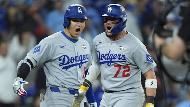 Nov 1, 2025; Toronto, Ontario, CAN; Los Angeles Dodgers second baseman Miguel Rojas (72) celebrates with two-way player Shohei Ohtani (17) after scoring against the Toronto Blue Jays in the ninth inning during game seven of the 2025 MLB World Series at Rogers Centre. Mandatory Credit: John E. Sokolowski-Imagn Images Nov 1, 2025; Toronto, Ontario, CAN; Los Angeles Dodgers second baseman Miguel Rojas (72) celebrates with two-way player Shohei Ohtani (17) after scoring against the Toronto Blue Jays in the ninth inning during game seven of the 2025 MLB World Series at Rogers Centre. Mandatory Credit: John E. Sokolowski-Imagn Images