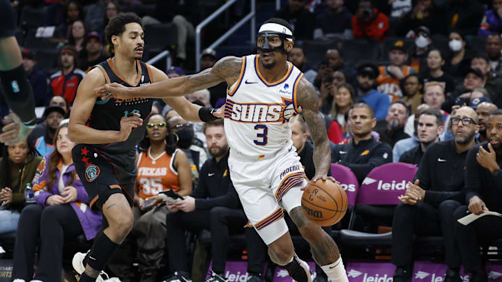 Feb 4, 2024; Washington, District of Columbia, USA; Phoenix Suns guard Bradley Beal (3) drives to the basket as Washington Wizards guard Jordan Poole (13) defends in the first half at Capital One Arena. Mandatory Credit: Geoff Burke-Imagn Images