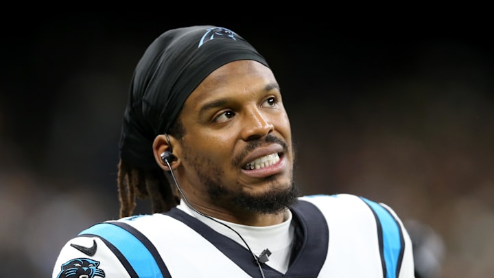 Jan 2, 2022; New Orleans, Louisiana, USA; Carolina Panthers quarterback Cam Newton (1) on the sidelines in the second quarter against the New Orleans Saints at the Caesars Superdome. Mandatory Credit: Chuck Cook-Imagn Images