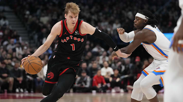 Mar 22, 2024; Toronto, Ontario, CAN; Toronto Raptors guard Gradey Dick (1) drives to the net against Oklahoma City Thunder forward Jalen Williams (8) during the second half at Scotiabank Arena. Mandatory Credit: John E. Sokolowski-Imagn Images