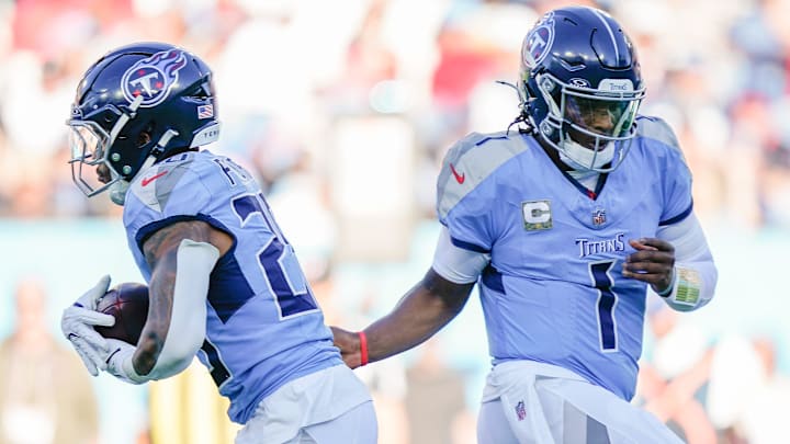 Tennessee Titans quarterback Cam Ward (1) hands off to running back Tony Pollard (20) during the fourth quarter against the Houston Texans at Nissan Stadium in Nashville, Tenn., Sunday, Nov. 16, 2025.