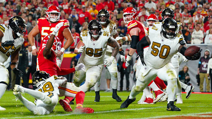 Oct 7, 2024; Kansas City, Missouri, USA; New Orleans Saints defensive tackle Khalen Saunders (50) intercepts a pass intended for Kansas City Chiefs wide receiver JuJu Smith-Schuster (9) during the second half at GEHA Field at Arrowhead Stadium. Mandatory Credit: Denny Medley-Imagn Images