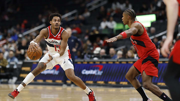 Oct 11, 2024; Washington, District of Columbia, USA; Washington Wizards guard Jordan Poole (13) dribbles the ball as Toronto Raptors guard Jahmi'us Ramsey (37) defends in the second quarter at Capital One Arena. Mandatory Credit: Geoff Burke-Imagn Images