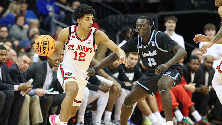 Jan 18, 2025; Newark, New Jersey, USA; St. John's basketball guard RJ Luis Jr. (12) dribbles as Seton Hall Pirates guard Garwey Dual (33) defends during the second half at Prudential Center. 