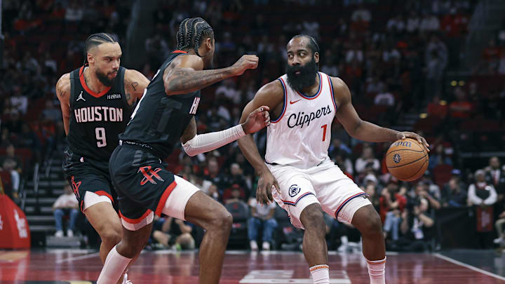 Los Angeles Clippers guard James Harden (1) controls the ball as Houston Rockets guard Jalen Green (4) defends during the first quarter at Toyota Center. Mandatory Credit: Troy Taormina-Imagn Images