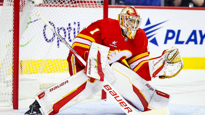 Sep 28, 2024; Calgary, Alberta, CAN; Calgary Flames goaltender Devin Cooley (1) guards his net against the Vancouver Canucks during the third period at Scotiabank Saddledome. Mandatory Credit: Sergei Belski-Imagn Images