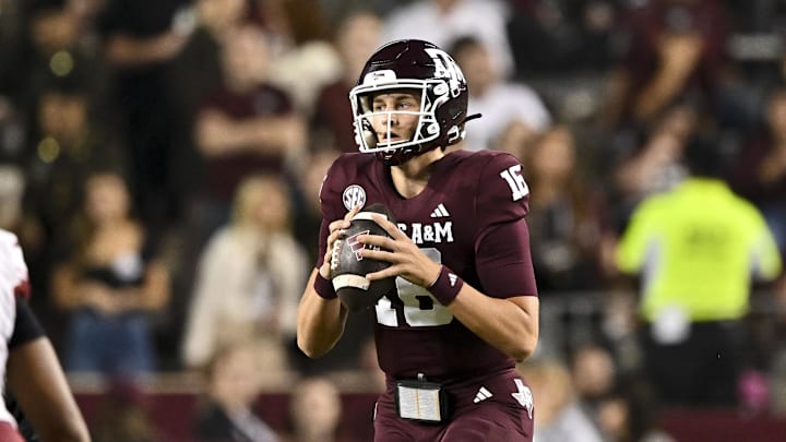 Nov 16, 2024; College Station, Texas, USA; Texas A&M Aggies quarterback Miles O'Neill (16) looks to pass the ball during the second half against the New Mexico State Aggies at Kyle Field. Mandatory Credit: Maria Lysaker-Imagn Images 