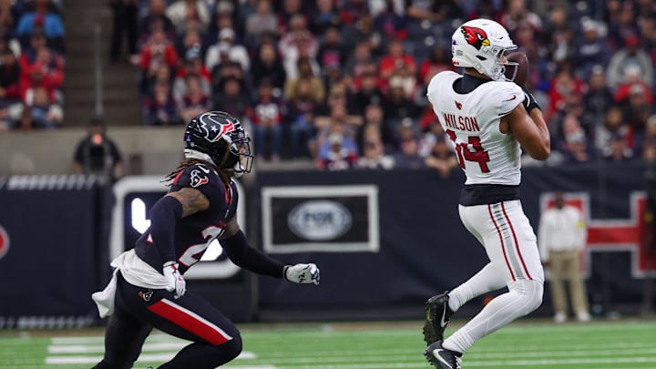 Dec 14, 2025; Houston, Texas, USA; Arizona Cardinals wide receiver Michael Wilson (14) catches a pass against Houston Texans cornerback Derek Stingley Jr. (24) in the third quarter at NRG Stadium. Mandatory Credit: Thomas Shea-Imagn Images Dec 14, 2025; Houston, Texas, USA; Arizona Cardinals wide receiver Michael Wilson (14) catches a pass against Houston Texans cornerback Derek Stingley Jr. (24) in the third quarter at NRG Stadium. Mandatory Credit: Thomas Shea-Imagn Images