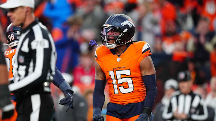 Nov 17, 2024; Denver, Colorado, USA; Denver Broncos linebacker Nik Bonitto (15) celebrates his sack in the second half against the Atlanta Falcons at Empower Field at Mile High. Mandatory Credit: Ron Chenoy-Imagn Images