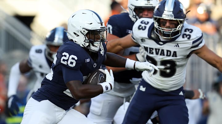 Penn State Nittany Lions running back Cam Wallace (26) runs with the ball during the fourth quarter against the Nevada Wolf Pack at Beaver Stadium.