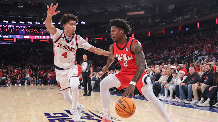 Dec 6, 2025; New York, New York, USA; Mississippi Rebels guard AJ Storr (2) looks to drive past St. John's basketball guard Oziyah Sellers (4) in the first half at Madison Square Garden. Dec 6, 2025; New York, New York, USA; Mississippi Rebels guard AJ Storr (2) looks to drive past St. John's basketball guard Oziyah Sellers (4) in the first half at Madison Square Garden.