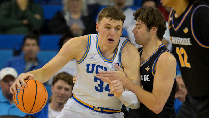 Dec 23, 2025; Los Angeles, California, USA; UCLA Bruins forward Tyler Bilodeau (34) is defended by UC Riverside Highlanders forward Dylan Godfrey (23) in the second half at Pauley Pavilion presented by Wescom Financial. Mandatory Credit: Jayne Kamin-Oncea-Imagn Images