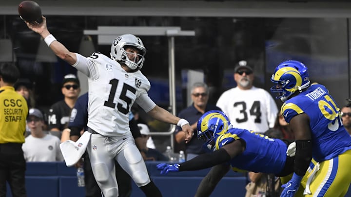 Oct 20, 2024; Inglewood, California, USA; Las Vegas Raiders quarterback Gardner Minshew (15) gets off a pass under pressure by Los Angeles Rams linebacker Jared Verse (8) and Los Angeles Rams defensive tackle Kobie Turner (91) during the third quarter at SoFi Stadium. Mandatory Credit: Robert Hanashiro-Imagn Images Oct 20, 2024; Inglewood, California, USA; Las Vegas Raiders quarterback Gardner Minshew (15) gets off a pass under pressure by Los Angeles Rams linebacker Jared Verse (8) and Los Angeles Rams defensive tackle Kobie Turner (91) during the third quarter at SoFi Stadium. Mandatory Credit: Robert Hanashiro-Imagn Images