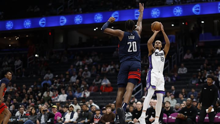 Apr 2, 2025; Washington, District of Columbia, USA; Sacramento Kings forward Keegan Murray (13) shoots the ball as Washington Wizards forward Alex Sarr (20) in the first half at Capital One Arena. Mandatory Credit: Geoff Burke-Imagn Images