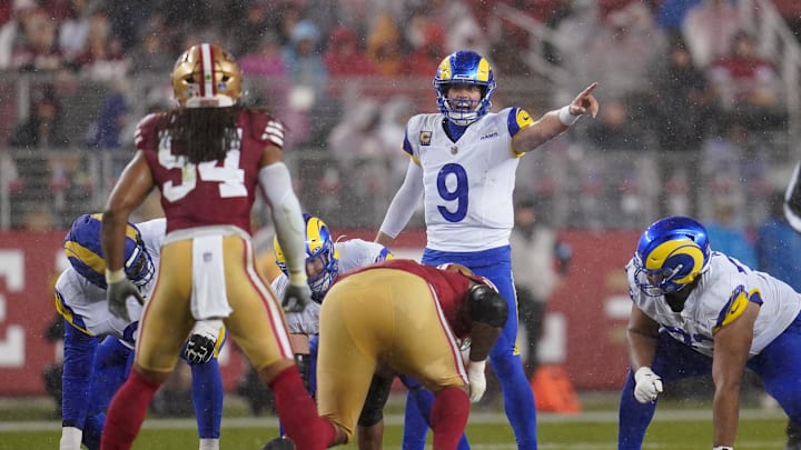 Dec 12, 2024; Santa Clara, California, USA; Los Angeles Rams quarterback Matthew Stafford (9) directs teammates before a play against the San Francisco 49ers in the second quarter at Levi's Stadium. Mandatory Credit: Cary Edmondson-Imagn Images