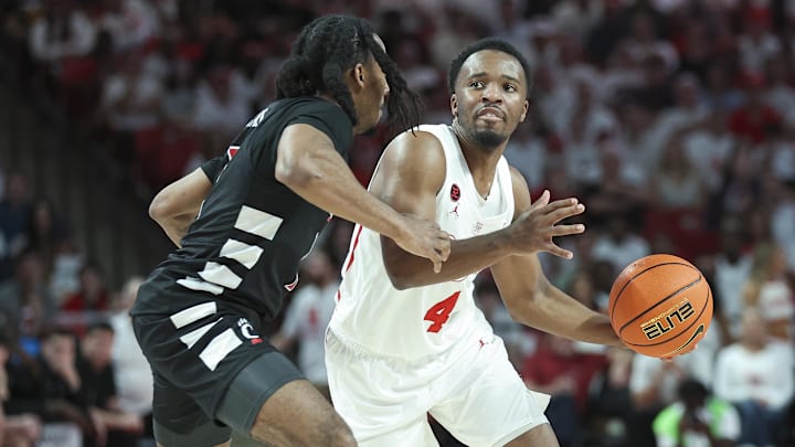 Feb 27, 2024; Houston, Texas, USA; Houston Cougars guard L.J. Cryer (4) controls the ball as Cincinnati Bearcats guard Day Day Thomas (1) defends during the second half at Fertitta Center. Mandatory Credit: Troy Taormina-Imagn Images Feb 27, 2024; Houston, Texas, USA; Houston Cougars guard L.J. Cryer (4) controls the ball as Cincinnati Bearcats guard Day Day Thomas (1) defends during the second half at Fertitta Center. Mandatory Credit: Troy Taormina-Imagn Images