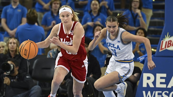 Dec 29, 2024; Los Angeles, California, USA; Nebraska Cornhuskers guard Britt Prince (23) brings the basketball up the court as UCLA Bruins guard Gabriela Jaquez (11) give chase during the second quarter at Pauley Pavilion presented by Wescom. Mandatory Credit: Robert Hanashiro-Imagn Images
