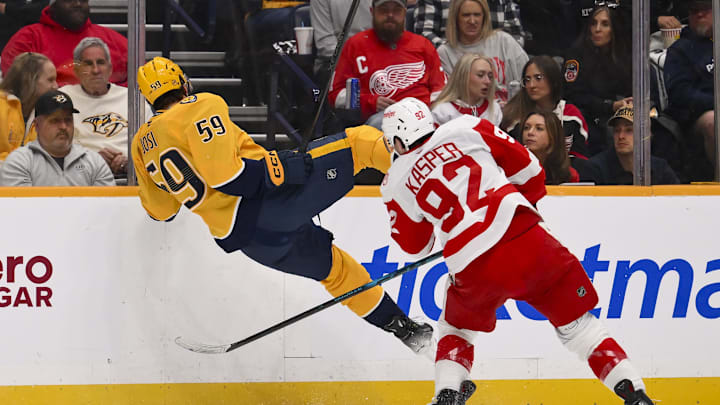 Mar 2, 2026; Nashville, Tennessee, USA; Detroit Red Wings center Marco Kasper (92) checks Nashville Predators defenseman Roman Josi (59) during the second period at Bridgestone Arena. Mandatory Credit: Steve Roberts-Imagn Images Mar 2, 2026; Nashville, Tennessee, USA; Detroit Red Wings center Marco Kasper (92) checks Nashville Predators defenseman Roman Josi (59) during the second period at Bridgestone Arena. Mandatory Credit: Steve Roberts-Imagn Images