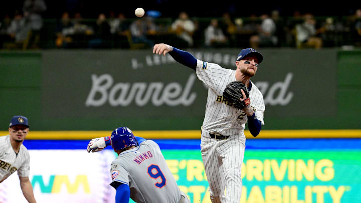 Milwaukee Brewers second baseman Brice Turang (2) throws to first during the first inning in game two of the Wildcard round for the 2024 MLB Playoffs against the New York Mets at American Family Field on Oct 2. Milwaukee Brewers second baseman Brice Turang (2) throws to first during the first inning in game two of the Wildcard round for the 2024 MLB Playoffs against the New York Mets at American Family Field on Oct 2.
