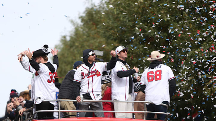 Nov 5, 2021; Atlanta, GA, USA; Atlanta Braves players from left A.J. Minter , Josh Tomlin, Luke Jackson and Tyler Matzek wave to the crowd during the World Series championship parade at Truist Park. Mandatory Credit: Brett Davis-Imagn Images
