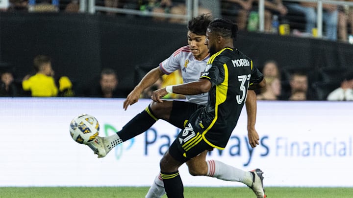 Sep 21, 2024; Columbus, Ohio, USA;  Columbus Crew defender Steven Moreira (31) passes the ball while Orlando City forward Ramiro Enrique (7) defends in the second half at Lower.com Field. Mandatory Credit: Trevor Ruszkowski-Imagn Images