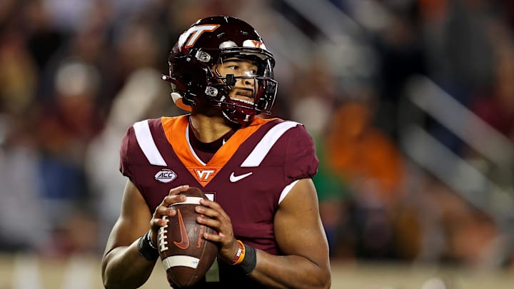 Nov 18, 2023; Blacksburg, Virginia, USA; Virginia Tech Hokies quarterback Kyron Drones (1) throws a pass against the North Carolina State Wolfpack at Lane Stadium.