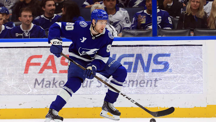 Dec 18, 2025; Tampa, Florida, USA; Tampa Bay Lightning defenseman J.J. Moser (90) skates with the puck against the Los Angeles Kings during the first period at Benchmark International Arena. Mandatory Credit: Kim Klement Neitzel-Imagn Images