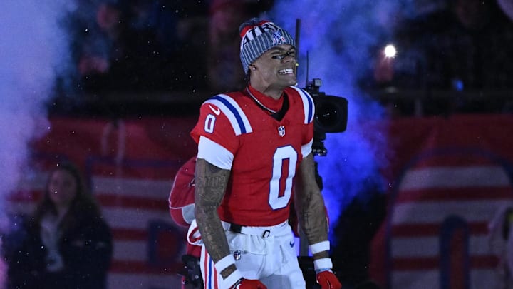 Dec 1, 2025; Foxborough, Massachusetts, USA; New England Patriots cornerback Christian Gonzalez (0) runs onto the field prior to the game against the New York Giants at Gillette Stadium. Mandatory Credit: Eric Canha-Imagn Images