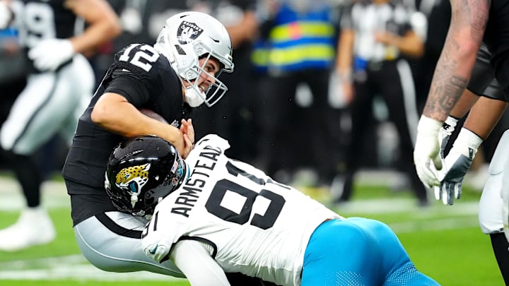 Dec 22, 2024; Paradise, Nevada, USA; Jacksonville Jaguars defensive end Arik Armstead (91) sacks Las Vegas Raiders quarterback Aidan O'Connell (12) during the first quarter at Allegiant Stadium. Mandatory Credit: Stephen R. Sylvanie-Imagn Images