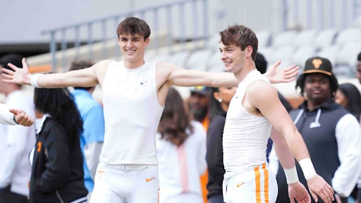 Tennessee quarterbacks George MacIntrye (15) and Jake Merklinger (12) warm up before the Orange & White spring game, Saturday, April 12, 2025. Tennessee quarterbacks George MacIntrye (15) and Jake Merklinger (12) warm up before the Orange & White spring game, Saturday, April 12, 2025.