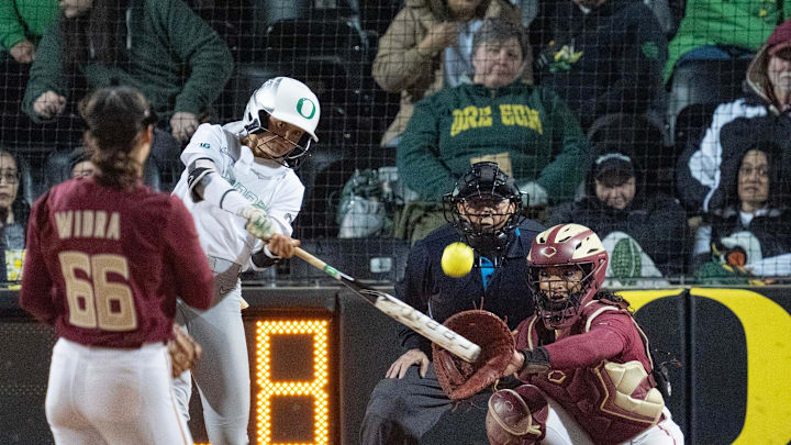 Kedre Luschar, center, drills a hit against Florida State in the Oregon Classic earlier in March. Ducks blanked the Seminoles twice in the tournament, winning 2-0 and 1-0.
