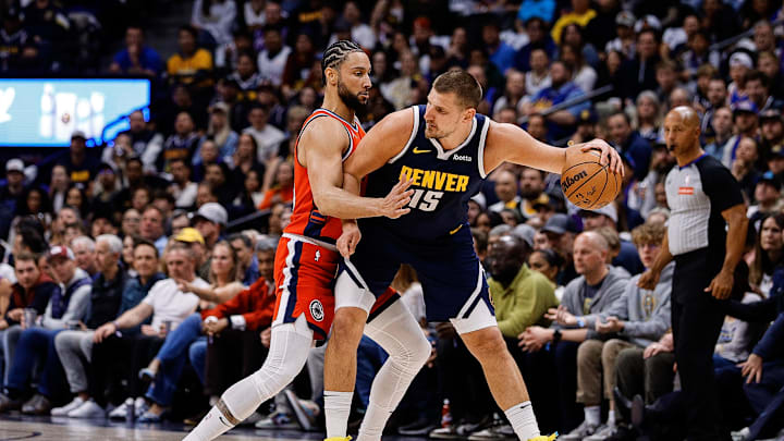 Denver Nuggets center Nikola Jokic controls the ball under pressure from Los Angeles Clippers guard Ben Simmons. Mandatory Credit: Isaiah J. Downing-Imagn Images