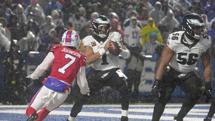Buffalo Bills cornerback Taron Johnson forces Philadelphia Eagles quarterback Jalen Hurts to scramble away from him during second half action against the Philadelphia Eagles at Highmark Stadium in Orchard Park on Dec. 28, 2025.