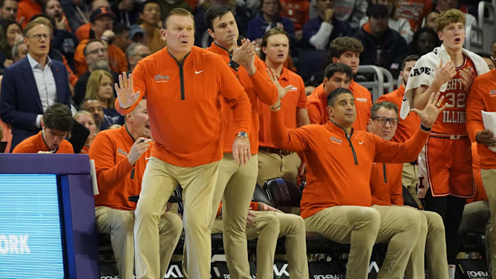 Dec 6, 2024; Evanston, Illinois, USA; Illinois Fighting Illini head coach Brad Underwood  gestures to his team against the Northwestern Wildcats during the first half at Welsh-Ryan Arena. Mandatory Credit: David Banks-Imagn Images