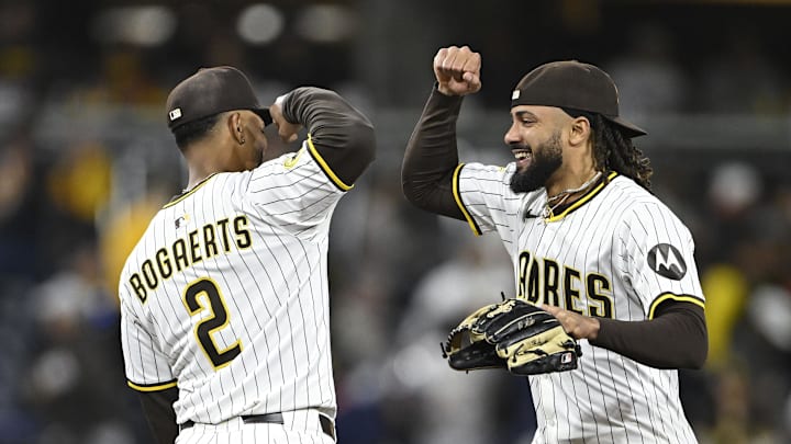 Apr 29, 2025; San Diego, California, USA; San Diego Padres shortstop Xander Bogaerts (2) and outfielder Fernando Tatis Jr. (23) celebrate after the Padres defeated the San Francisco Giants 7-4 at Petco Park. Mandatory Credit: Denis Poroy-Imagn Images